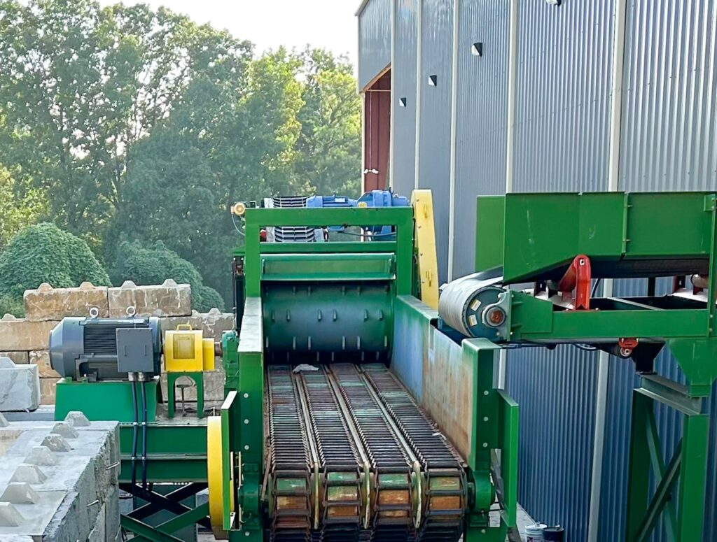 West Salem Machinery infeed conveyor to move wood waste to horizontal grinder