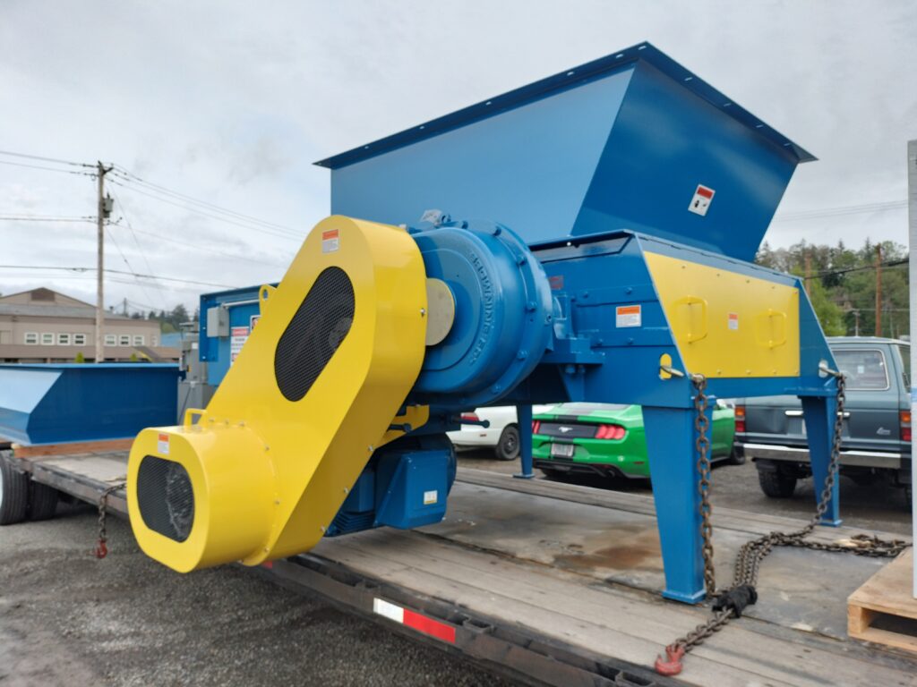Vertical hopper grinder with hydraulic Ram for mill trip being shipped