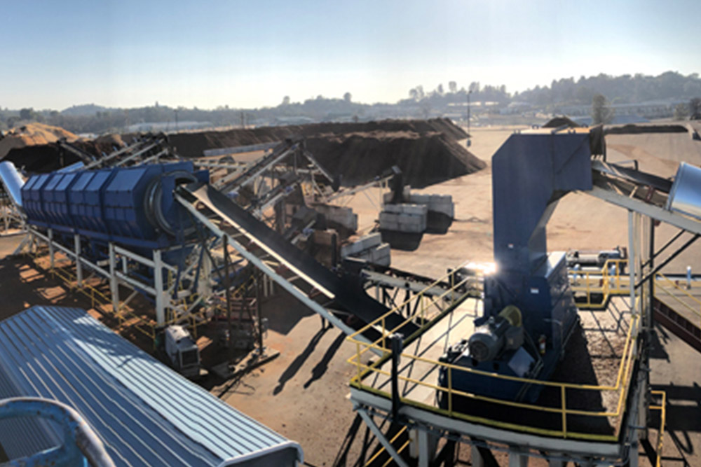 Biomass feedstock preparation systems